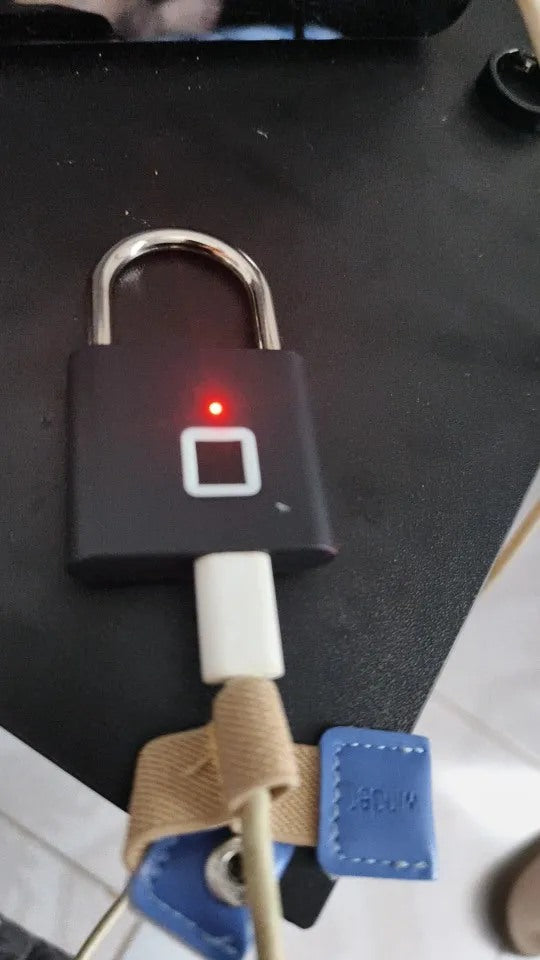 Buyer-submitted marketplace review photo showing the O11 fingerprint padlock in real-world use