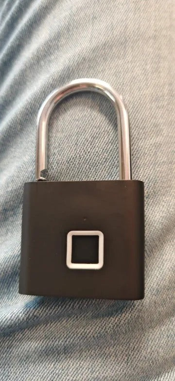 Buyer-submitted marketplace review photo showing the O11 fingerprint padlock in real-world use