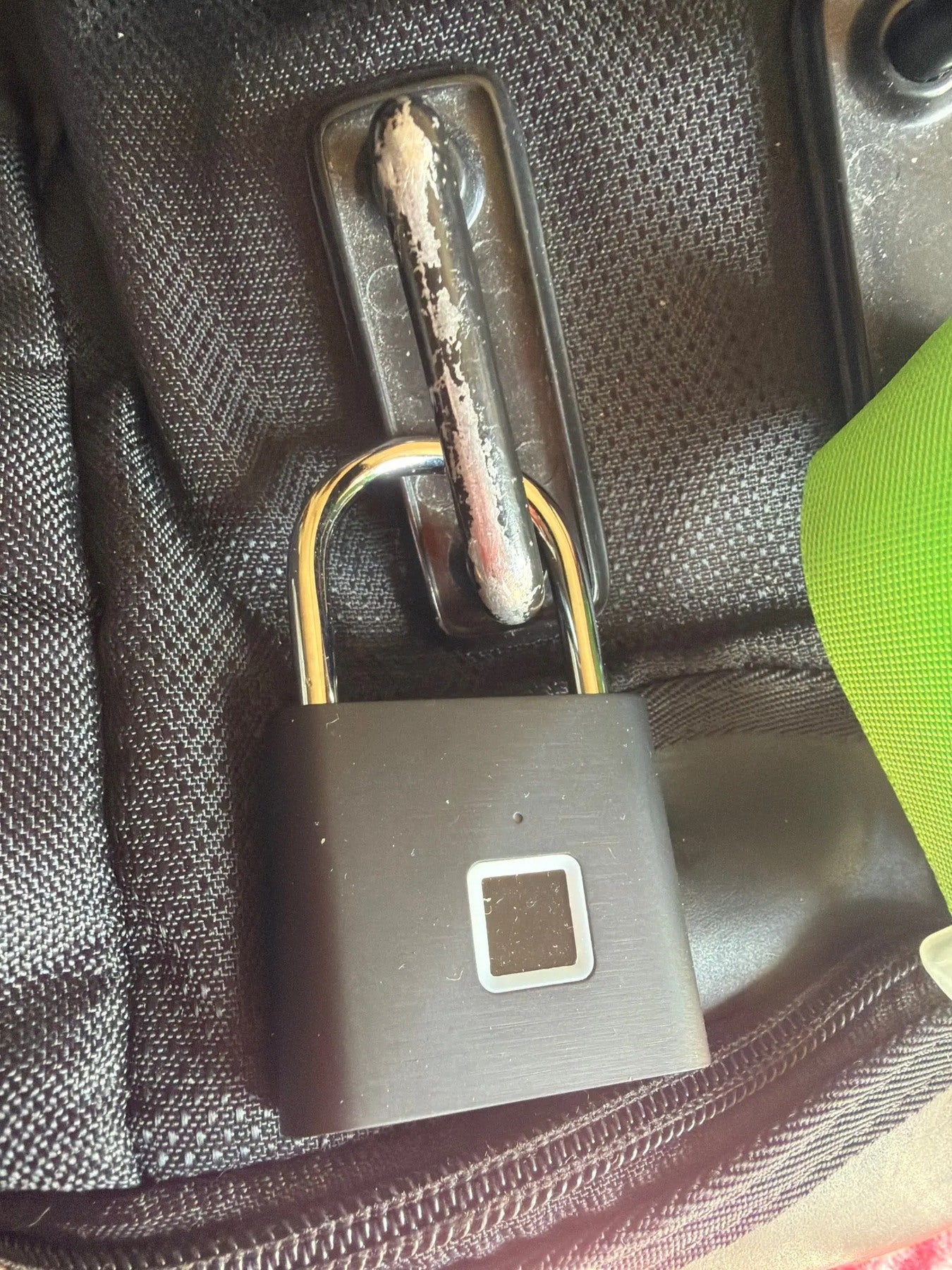 Buyer-submitted marketplace review photo showing the O11 fingerprint padlock in real-world use