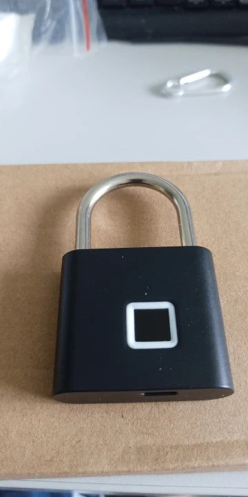 Buyer-submitted marketplace review photo showing the O11 fingerprint padlock in real-world use