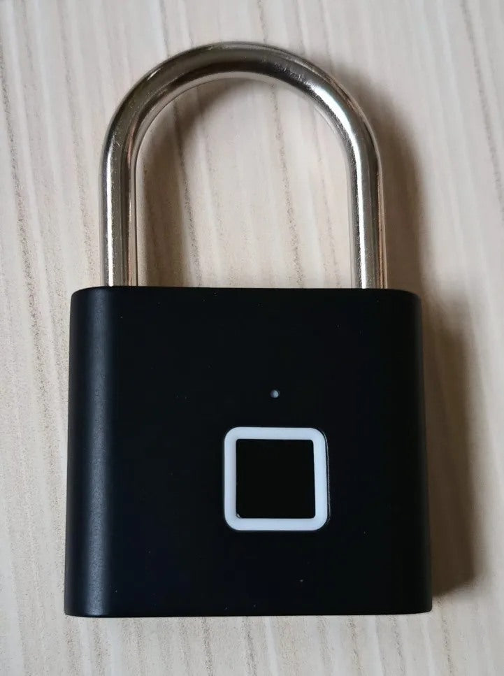 Buyer-submitted marketplace review photo showing the O11 fingerprint padlock in real-world use