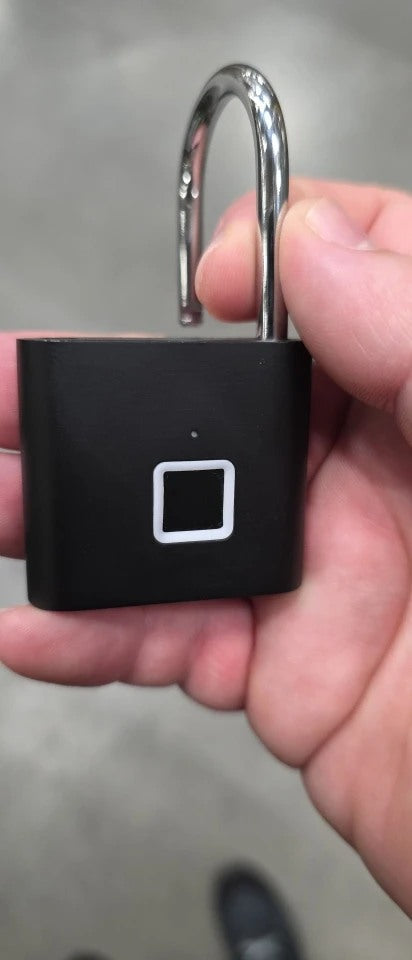 Buyer-submitted marketplace review photo showing the O11 fingerprint padlock in real-world use
