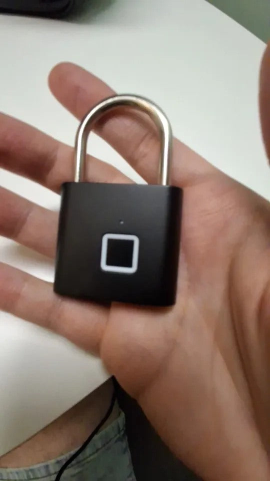 Buyer-submitted marketplace review photo showing the O11 fingerprint padlock in real-world use