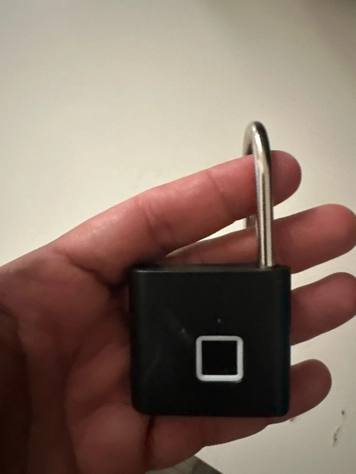 Buyer-submitted marketplace review photo showing the O11 fingerprint padlock in real-world use