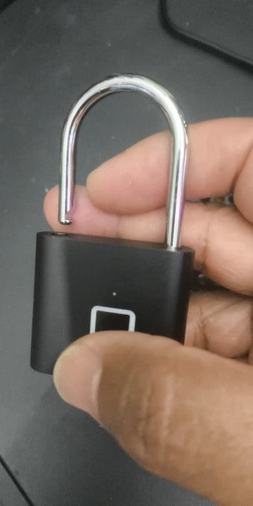 Buyer-submitted marketplace review photo showing the O11 fingerprint padlock in real-world use