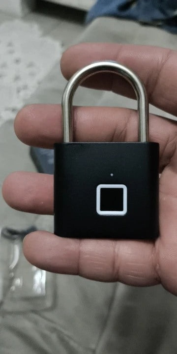 Buyer-submitted marketplace review photo showing the O11 fingerprint padlock in real-world use