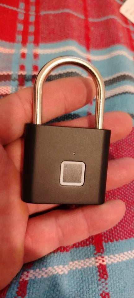 Buyer-submitted marketplace review photo showing the O11 fingerprint padlock in real-world use